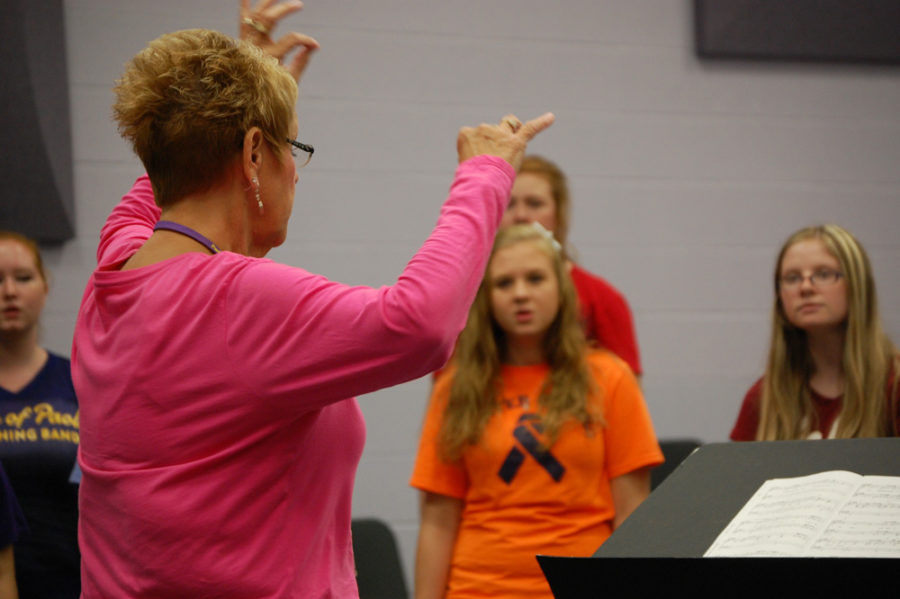 Choir teacher Debra Stroud conducts her students.