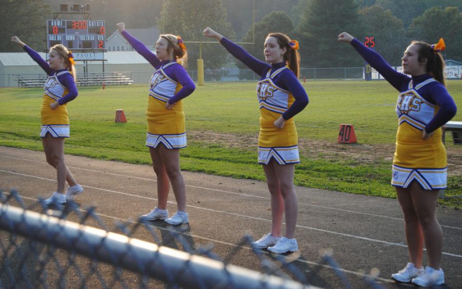 The JV cheerleaders pump up the crowd during a cheer.