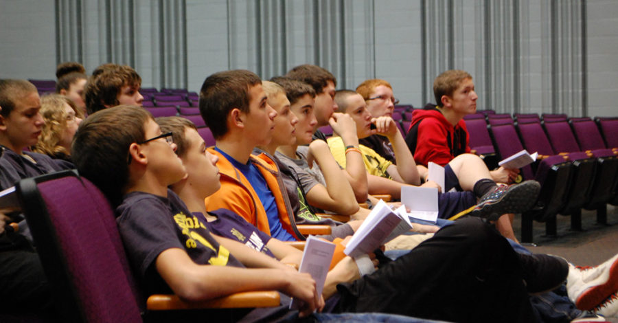 A row of eighth grade boys give their full attention to the guest speaker at the Liberty Day Presentation.