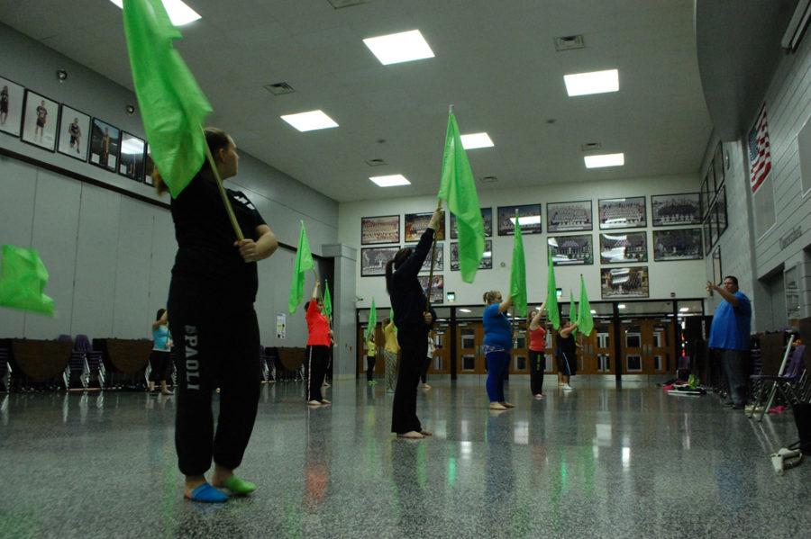 Winter+guard+practices+their+warm-ups.