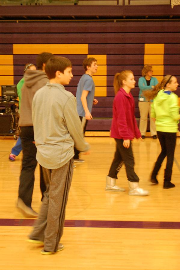 Seventh and eighth grade students play basketball during their lunch and recess time in the lower gym.