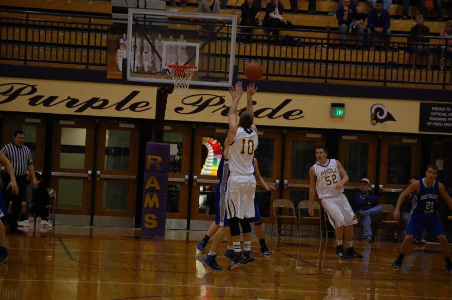 Senior Tanner Wroblewski jumps up to shoot a three pointer for the Rams.