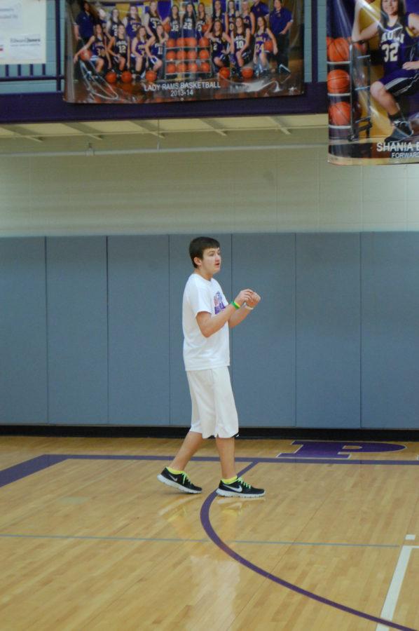 Eighth grader Braydon Kloss moves down the floor to get the basketball from his teammate at junior high recess on Wednesday. 