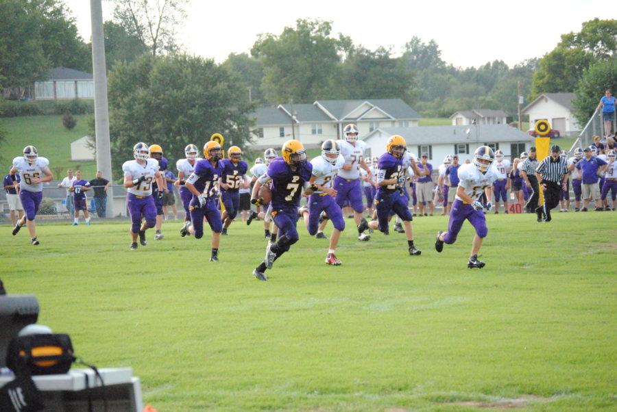 Freshman Tyler Smith runs the football in for a touchdown against Scottsburg.