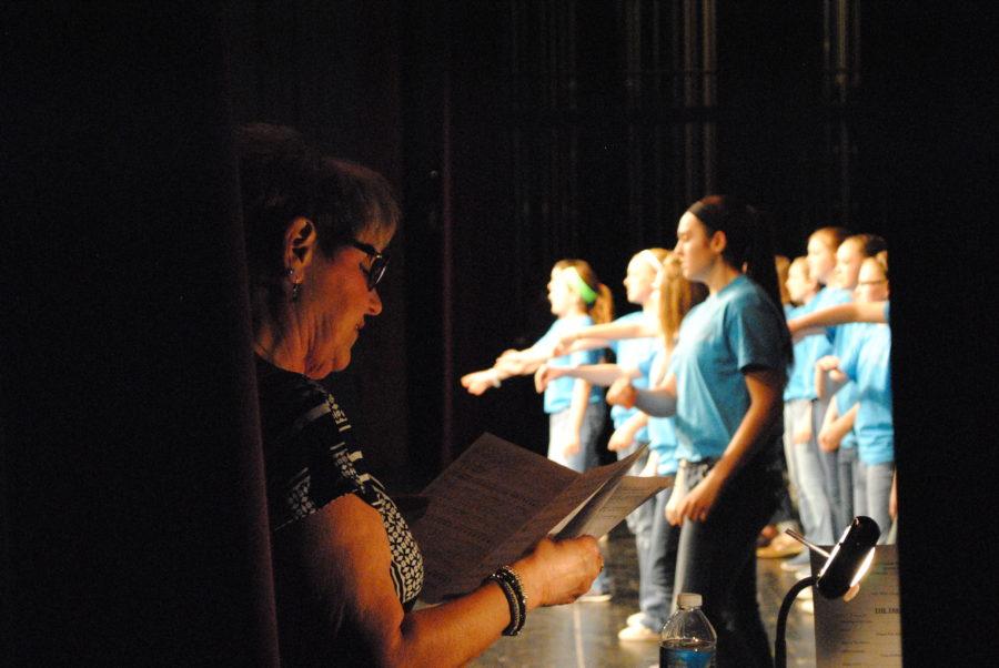 Director Debra Stroud sings along with the junior high choir. 