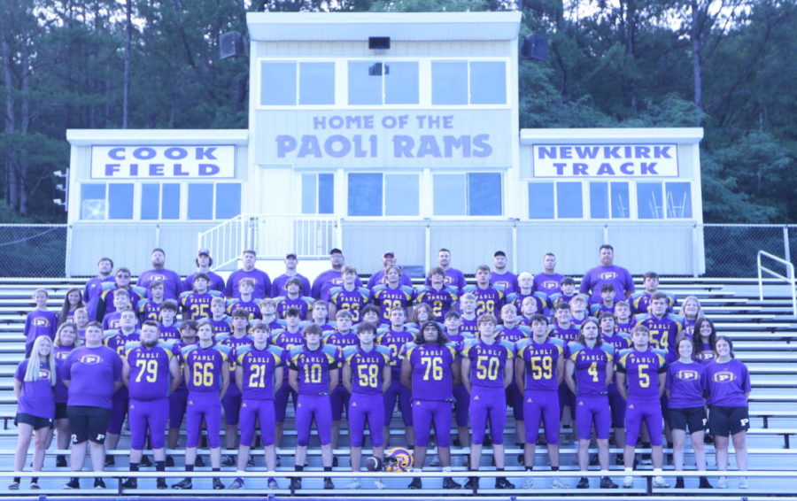 The Paoli Rams football team takes their team photos early in the morning.