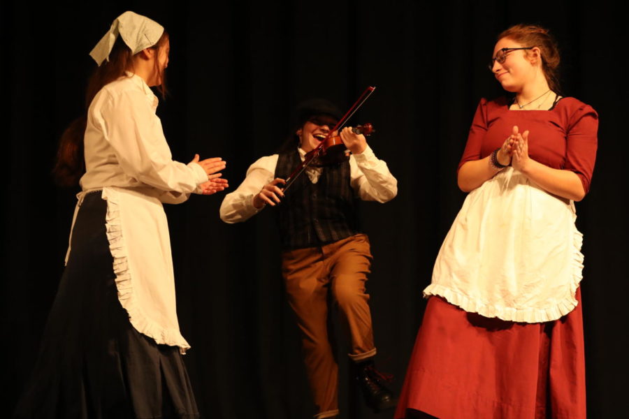 Senior Ellie Sims dances around the stage as the fiddler.