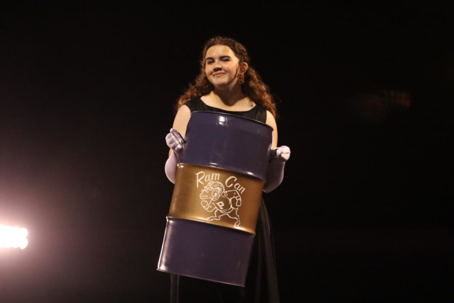 Junior Liliann Woodsmall holds up Ram Can.