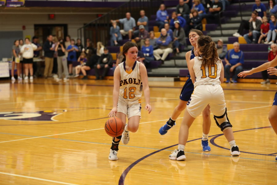 Sophomore Lily Hall dribbles to the basket.