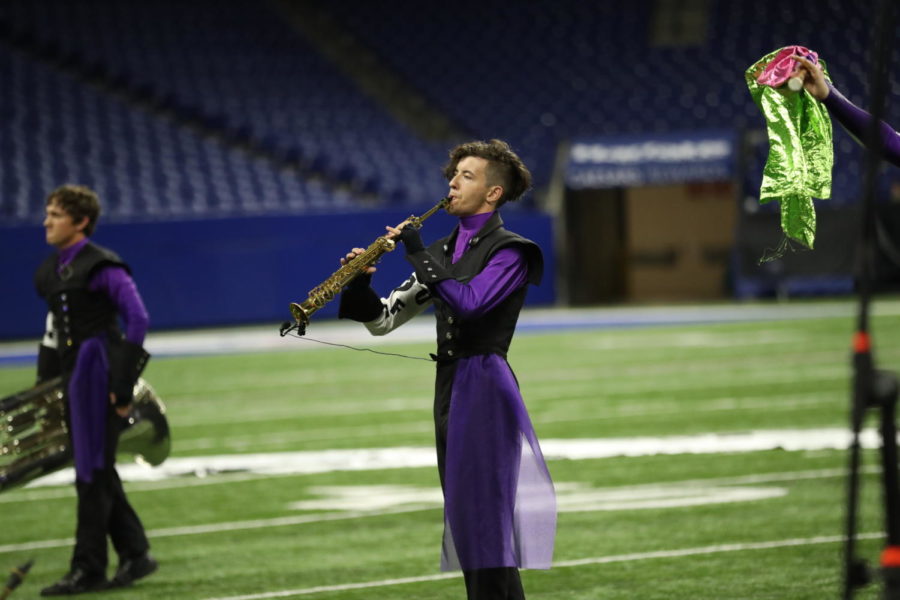 Senior Brody Wilcox performs his solo at State Finals on the soprano saxophone. Wilcox also performed alto saxophone during the 
show.