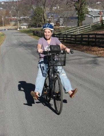 Science teacher Laurie Jo Andry rides her bike to school.