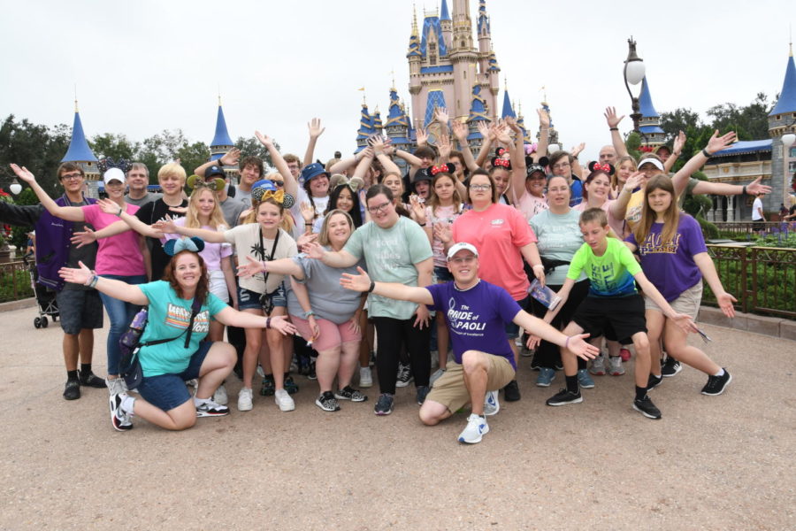 The+Pride+poses+in+front+of+Cinderellas+Castle+at+Magic+Kingdom.