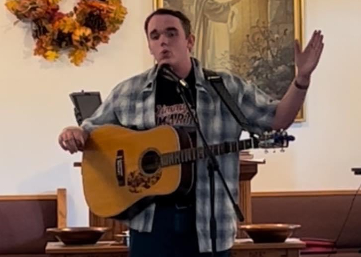 Blankenship performs a song for his church on a Sunday morning.