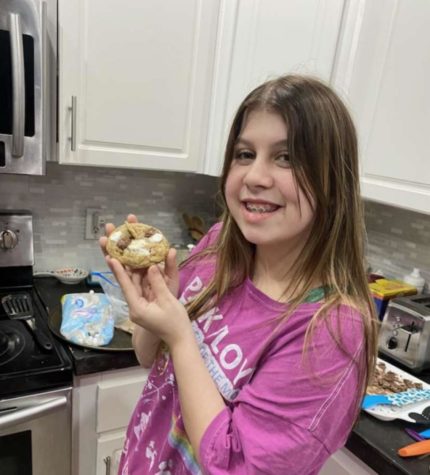 Anderson smiles and shows off one of her freshly-made S’mores cookies.