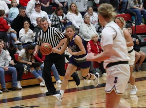 Senior Amelia Hess brings the ball up the court during the Sectional Championship.