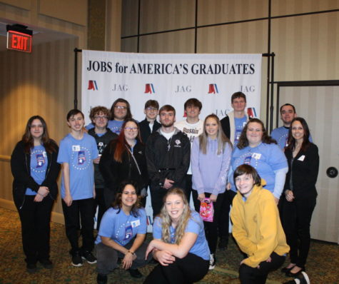 Members of JAG pose for a photo after the event.