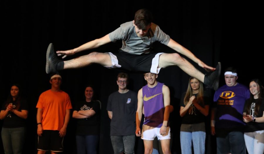 Brody Wilcox does a high toe-touch as part of his dance.