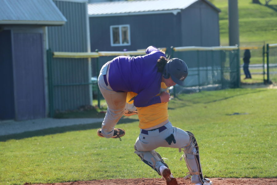 Sophomore Peyton Baker tries to jump over freshman Treighlin Minton.