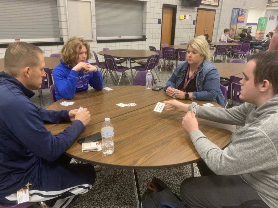 Two teams face off in the early round of the euchre tournament. Pictured from left are Throop gym teacher Tyler Kumpf, eighth grader Sylas Washington, Special Ed Teacher Alexis Speer and senior Wyatt Blankenship.