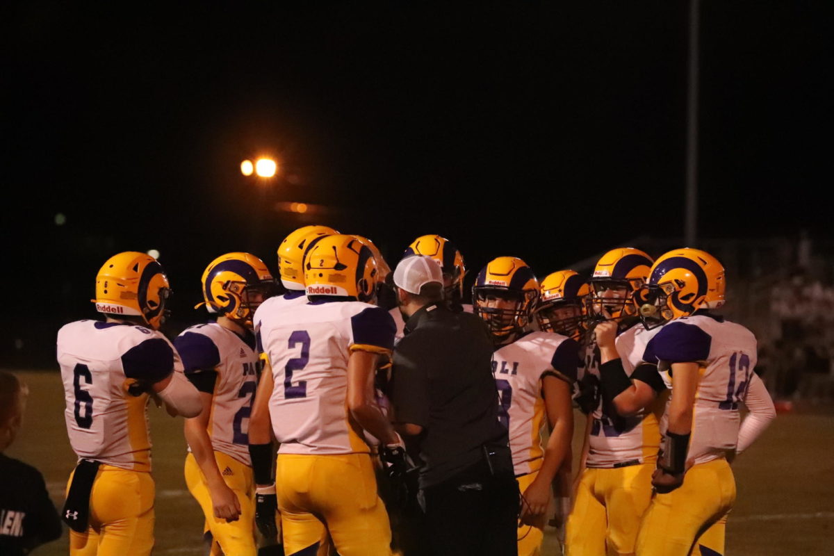 The Rams huddle during the late game at Corydon before their win.