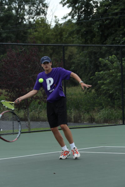 Sophomore Tim Husemeyer prepare to return the hit with a forehand