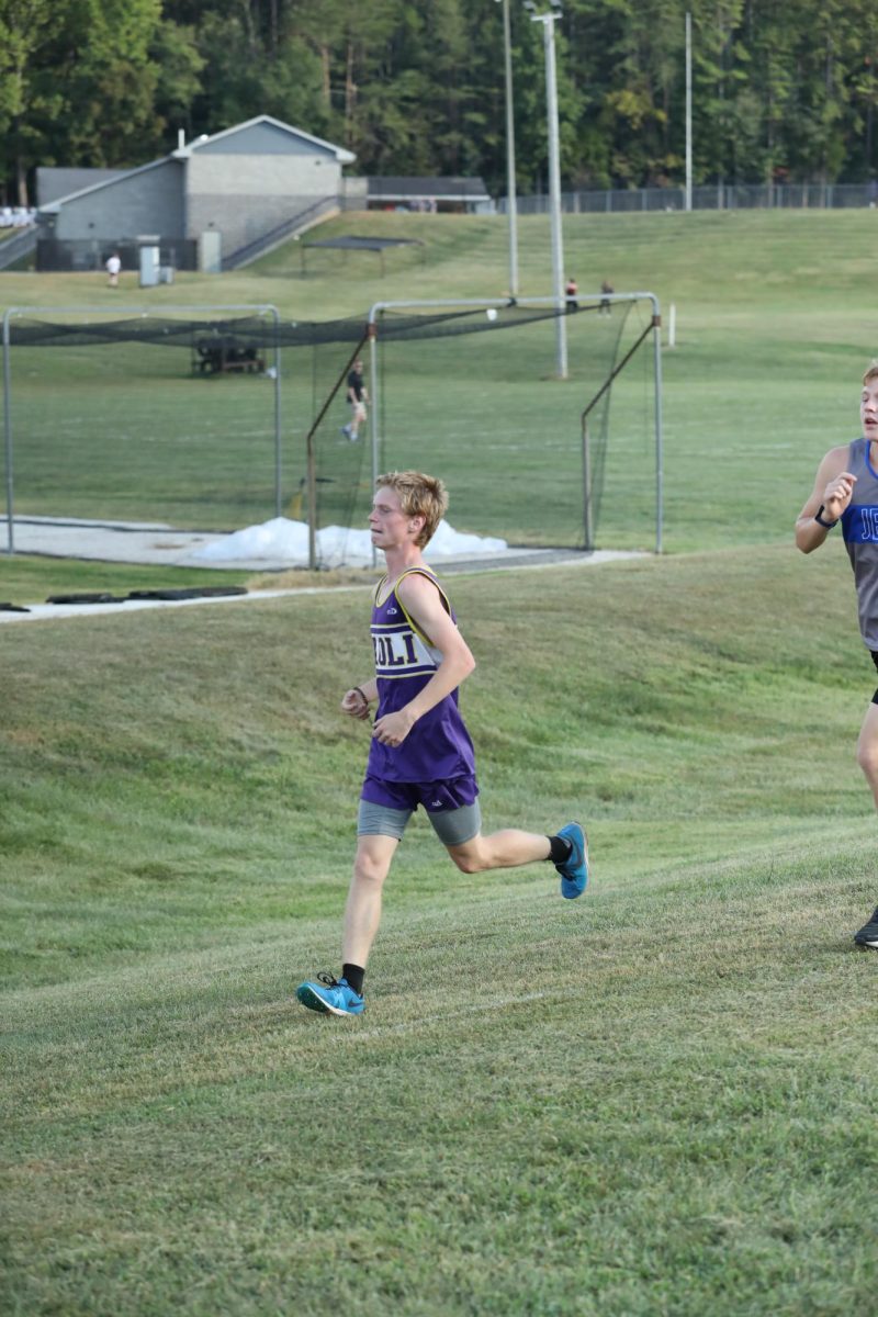 Sophomore Jacoby Piper finishing a race.