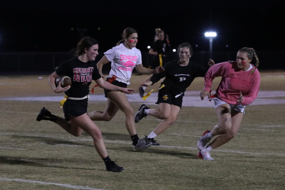 Junior Lilly Hall attempts to dodge her opponents.