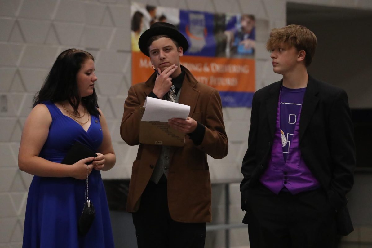 Sophomore Cannon Lambdin plays his detective role while junior Ava Green and freshman Garrett Cook works as his assistants.