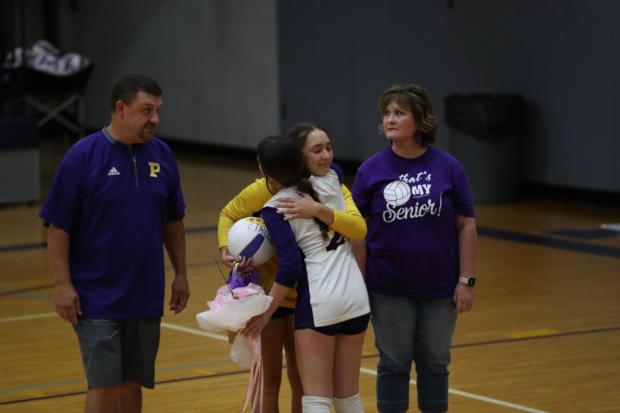 Senior Lily Stroud hugs junior Lilly Hall.
