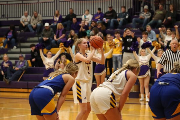 A photo of Senior Carly Higgins shooting a free-throw 