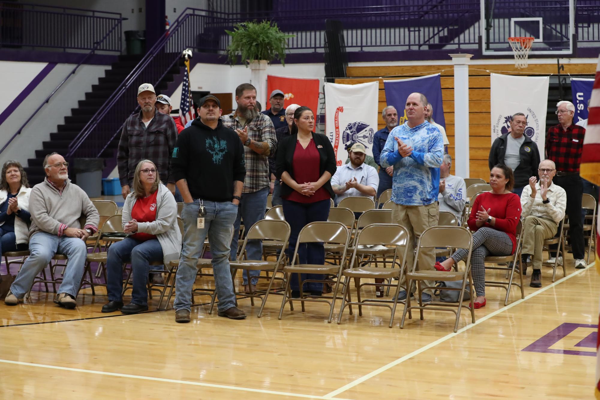 All the veterans who attended the program standing for the pledge