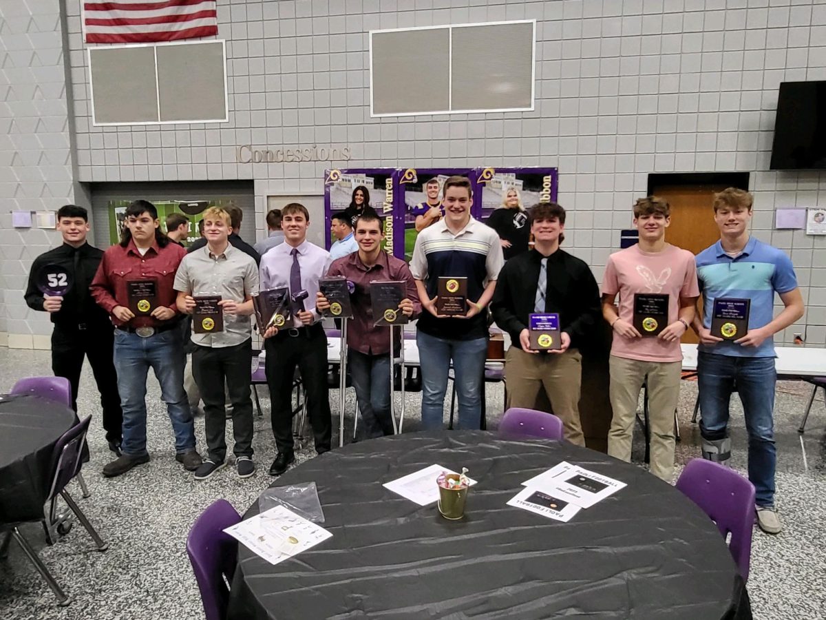 Members of the football team pose at their banquet on December 2.
