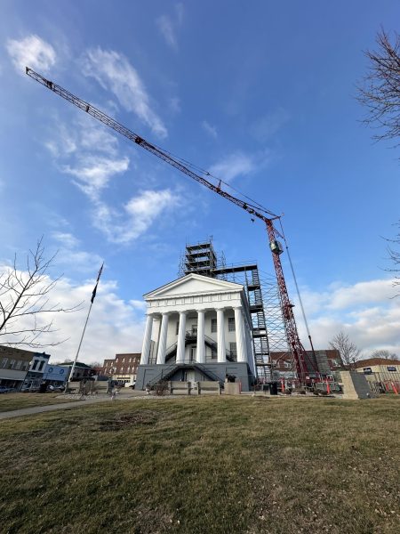 A crane hovers over the Courthouse in preparation for repairs.