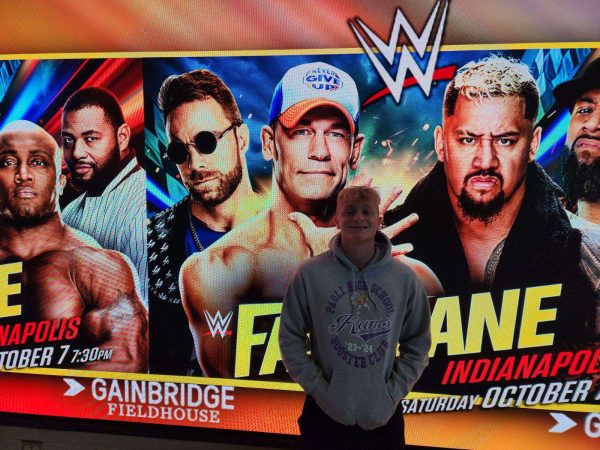 Junior Fletcher Cole stands in front of the WWE sign in Indianapolis.