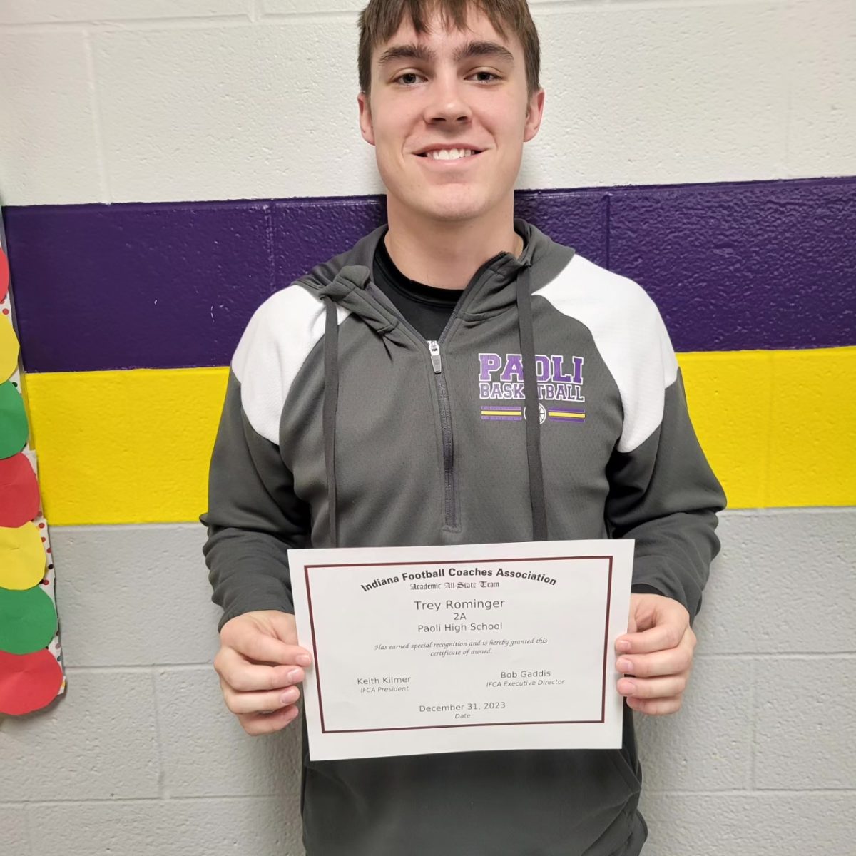 Senior Trey Rominger poses with his certificate.