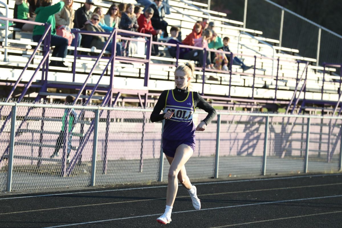 Senior Carley Higgins races in her winning race during the first meet.