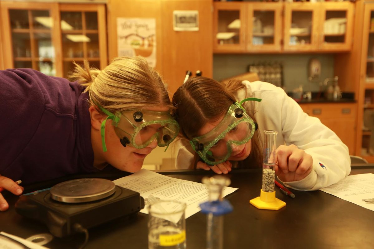 Junior Libby Newkirk and Sophomore Ada McSpadden focus on their experiment.
