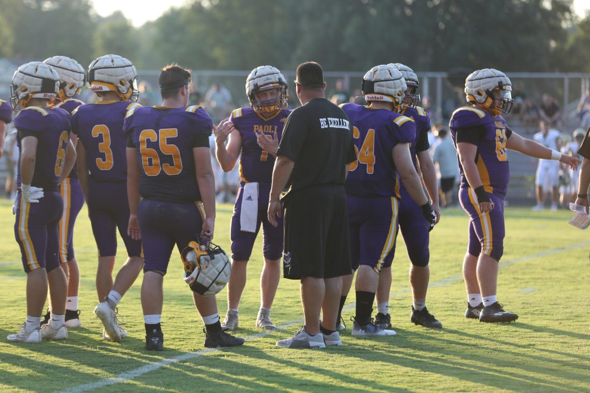  Coach Aaron Hannon talks to his players.