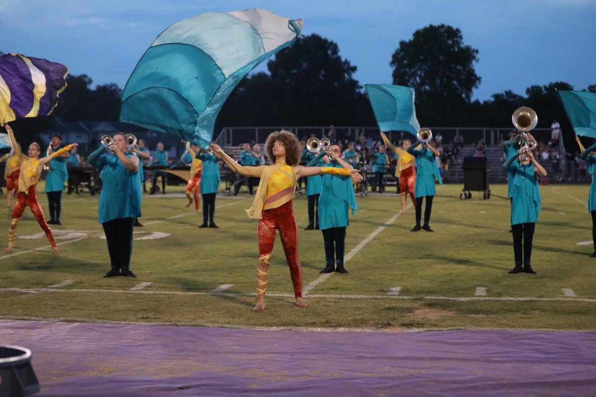  Sophomore Zoey Jenkins performs the opening swing flag work.
