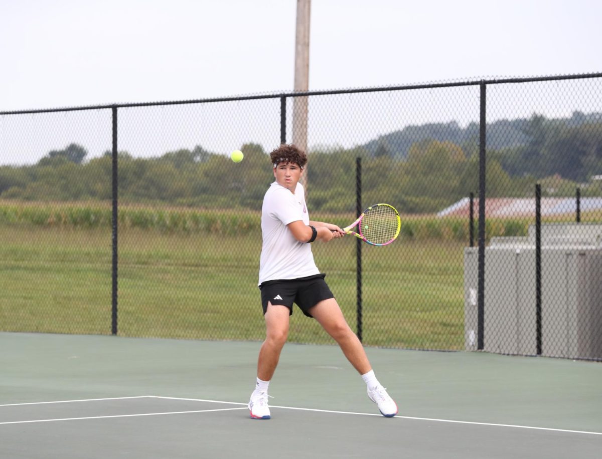 Sophomore Klayton Turner hits the ball across the court.