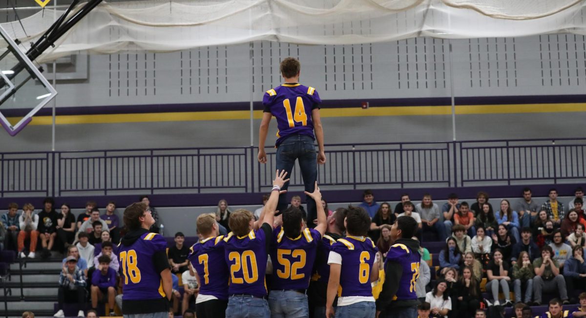 Senior Football boys do a cheer stunt for the contest.
