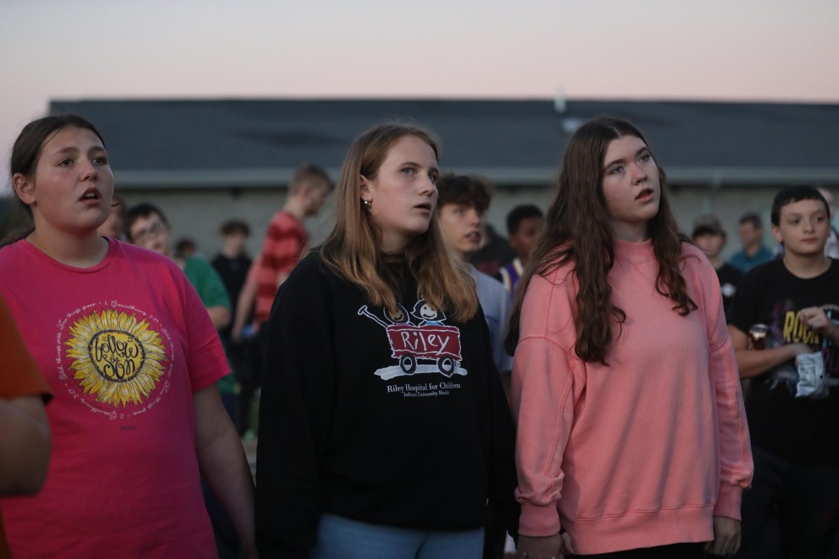 Students sing along.