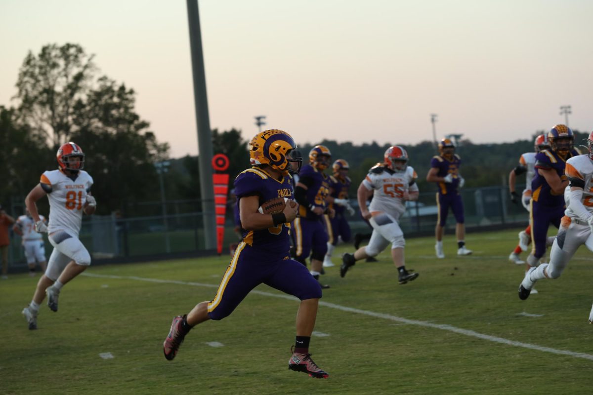 Junior Tyler Hannon running the ball and scoring a touchdown