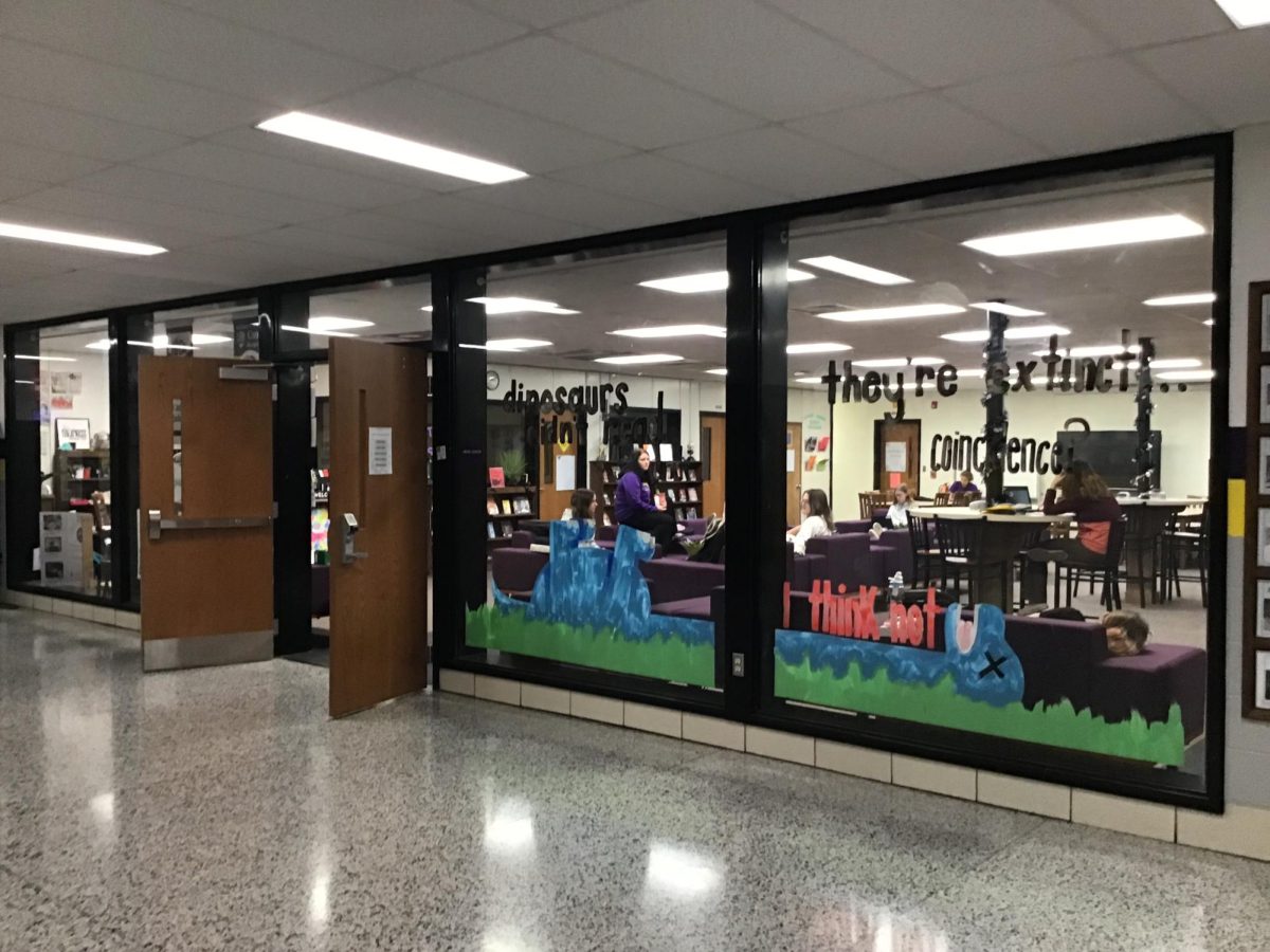 Library windows are once again painted by senior Haylie Gilliatt.