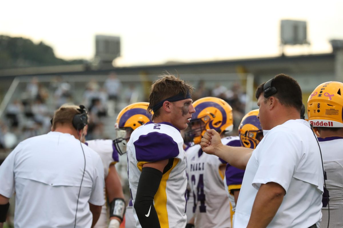 Coach Hannon talking to Junior Trey Minton 