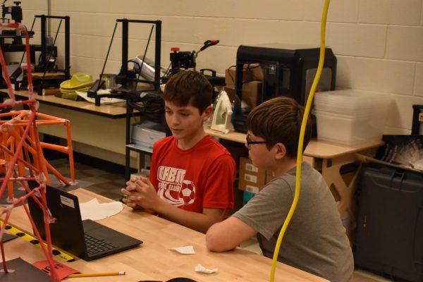 Seventh Graders Jude Cangey, and Gabriel Albertson watch the stem podcast.