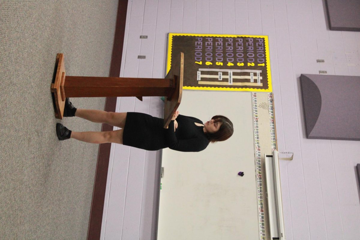Freshman Kaden Warren reading her contemporary poem.
