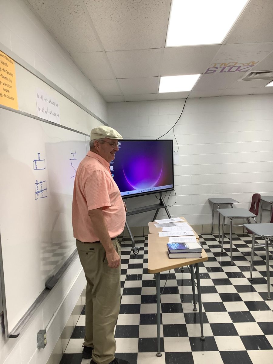 Math Teacher Paul Bosley waits to present a lesson to his class.