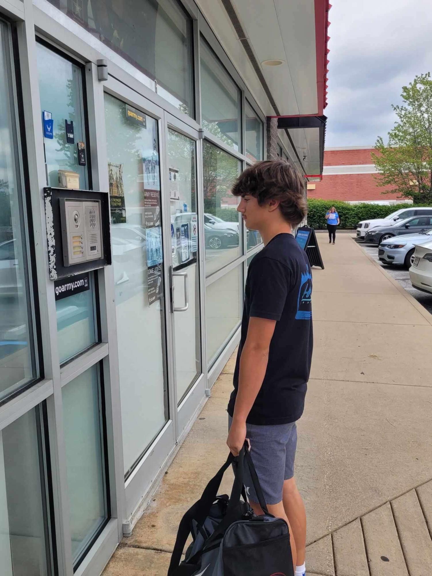 Senior Hayden Bostock waits to enter the facility to take his MEPS Exam.