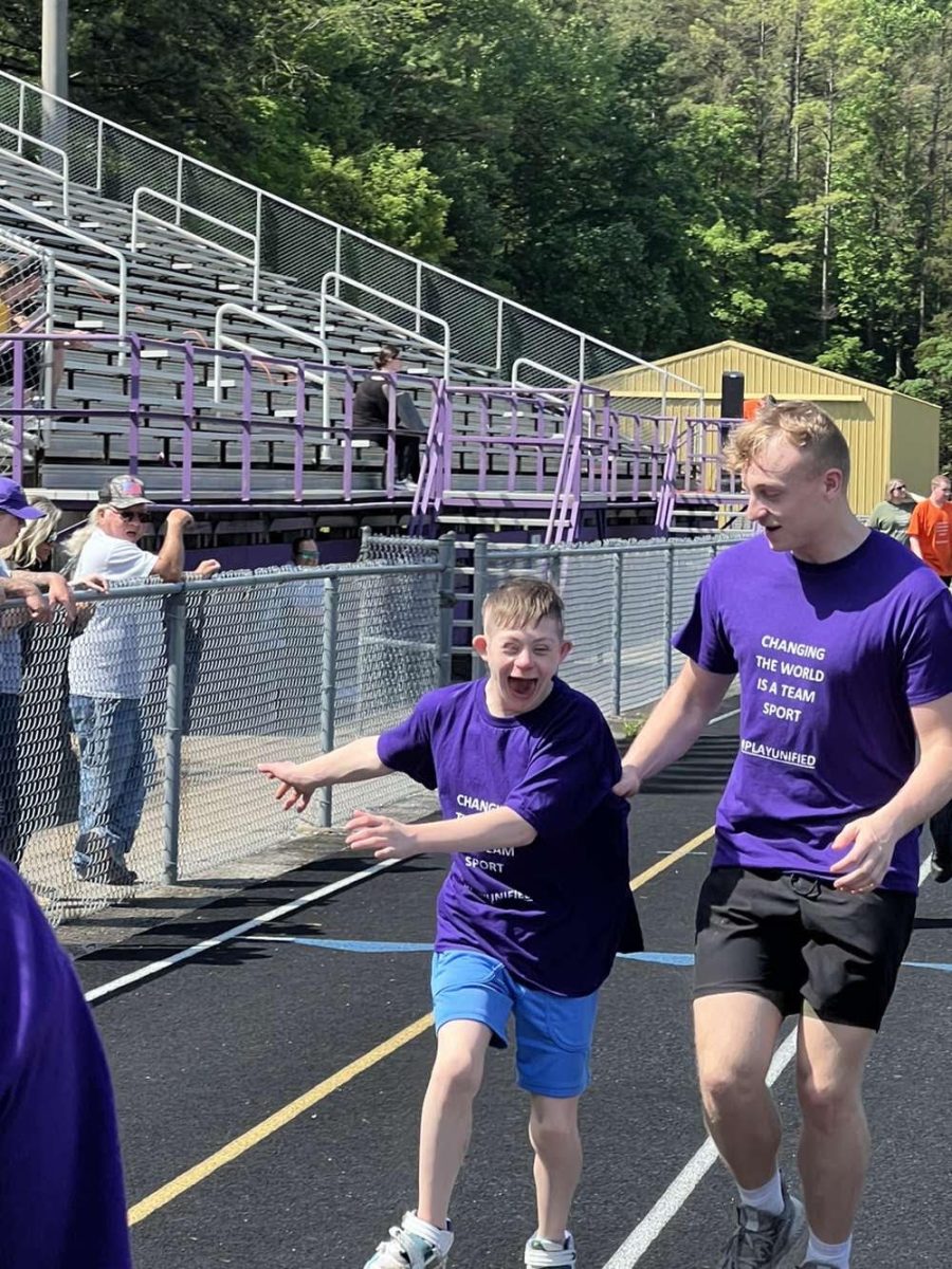 Senior Fletcher Cole runs with sophomore Sam Babbit